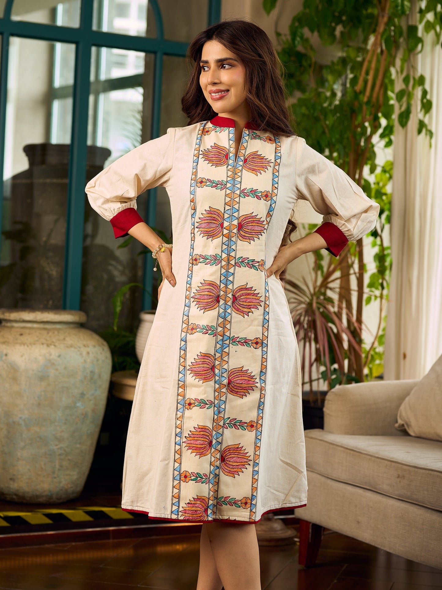 Artisan-crafted off-white Madhubani dress with beautiful hand-painted motifs and trim.