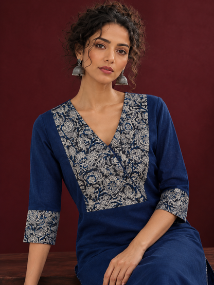 Elegant Navy Blue Kurta with Contrast Kalamkari Print Yoke and Matching Sleeve Cuffs — seated detail