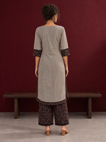 Elegant Beige Ajrakh Striped Cotton Kurta with Contrast Black Floral patch in Neckline & Sleeve Cuffs — back view