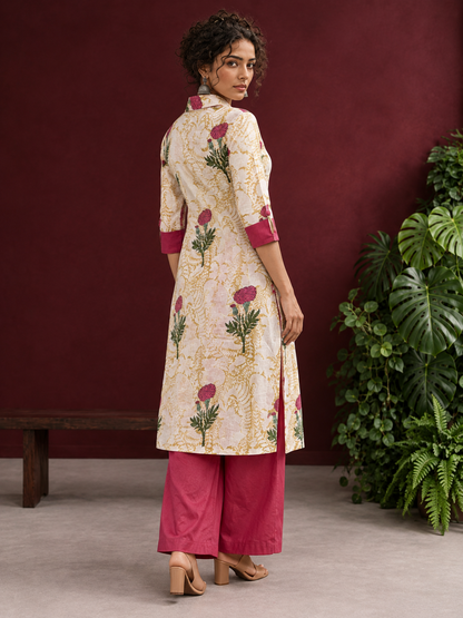 Ivory floral printed kurta with pink and green flowers, a V-neck, and contrasting pink cuffs. — back view