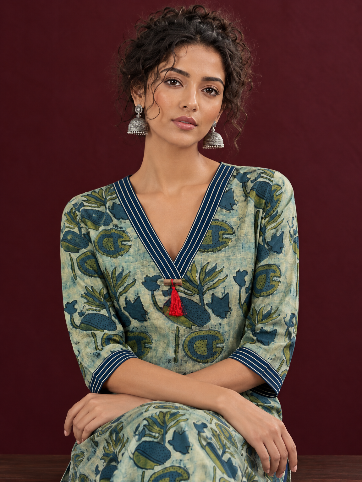 Sage Green Cotton Kurta with Hand Block Printed Floral Motifs and Contrast Navy Striped V-Neck — seated detail — view 5