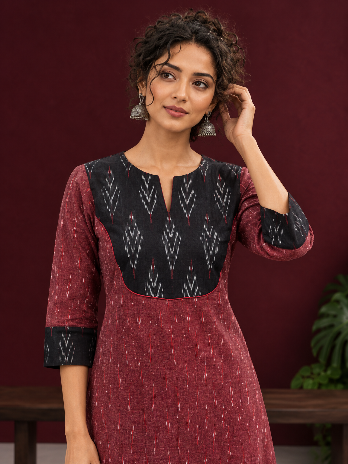 Elegant Maroon Ikat Cotton A Line Kurta With Black Yoke & Ikat Cuff Detailing — styled view — view 4