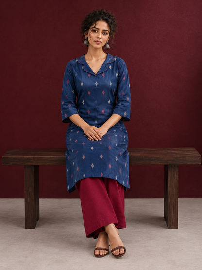 Navy Blue Cotton Kurta with Ikat Motif Print and Contrast Red Stitched Collar Neckline — seated