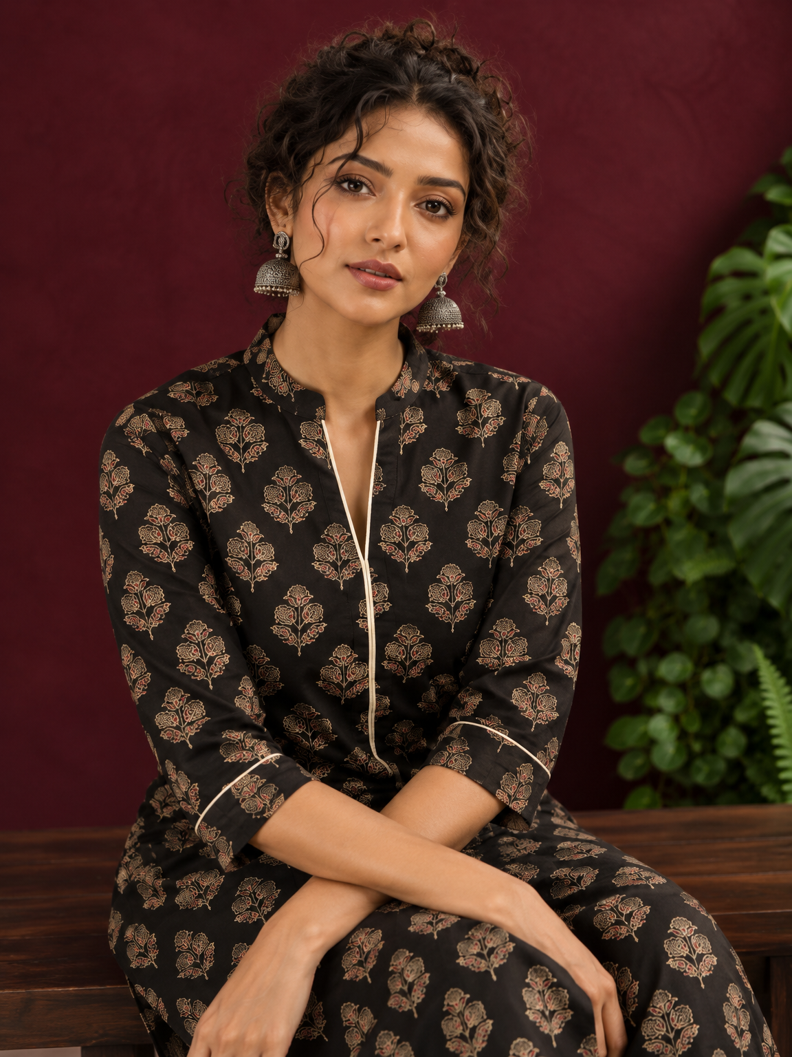 Elegant Black Cotton Kurta with Floral Block Print and Contrast Collar Piping — seated detail — view 4