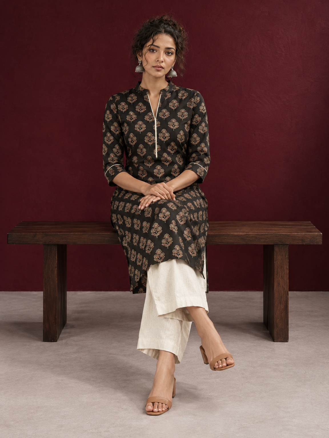 Elegant Black Cotton Kurta with Floral Block Print and Contrast Collar Piping — seated — view 5