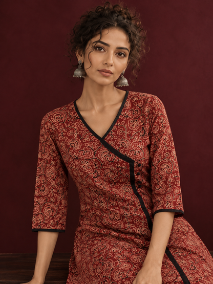 Maroon Cotton Kurta with Ajrakh Floral Print, Black Contrast Binding & Angrakha Style Wrap Front — seated detail