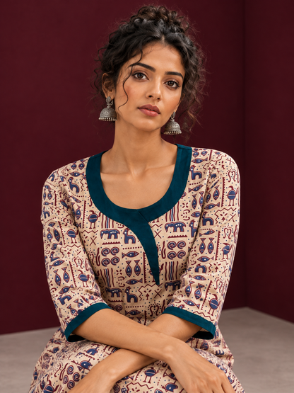 Beige Cotton Kurta with Tribal Motif Print & Contrast Teal Blue V-Neck Panel — seated detail