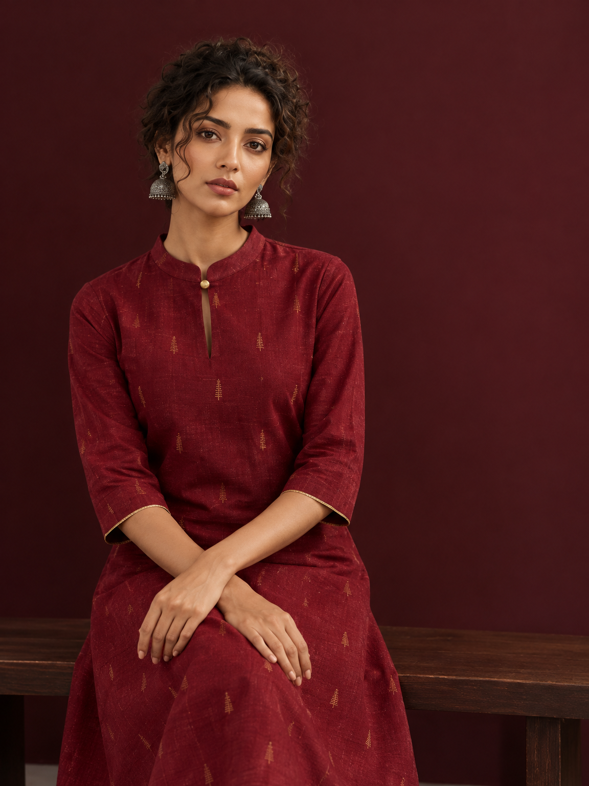 Elegant Maroon Cotton Silk Kurta with Golden Motif Print With Mandarin Collar — seated detail — view 6