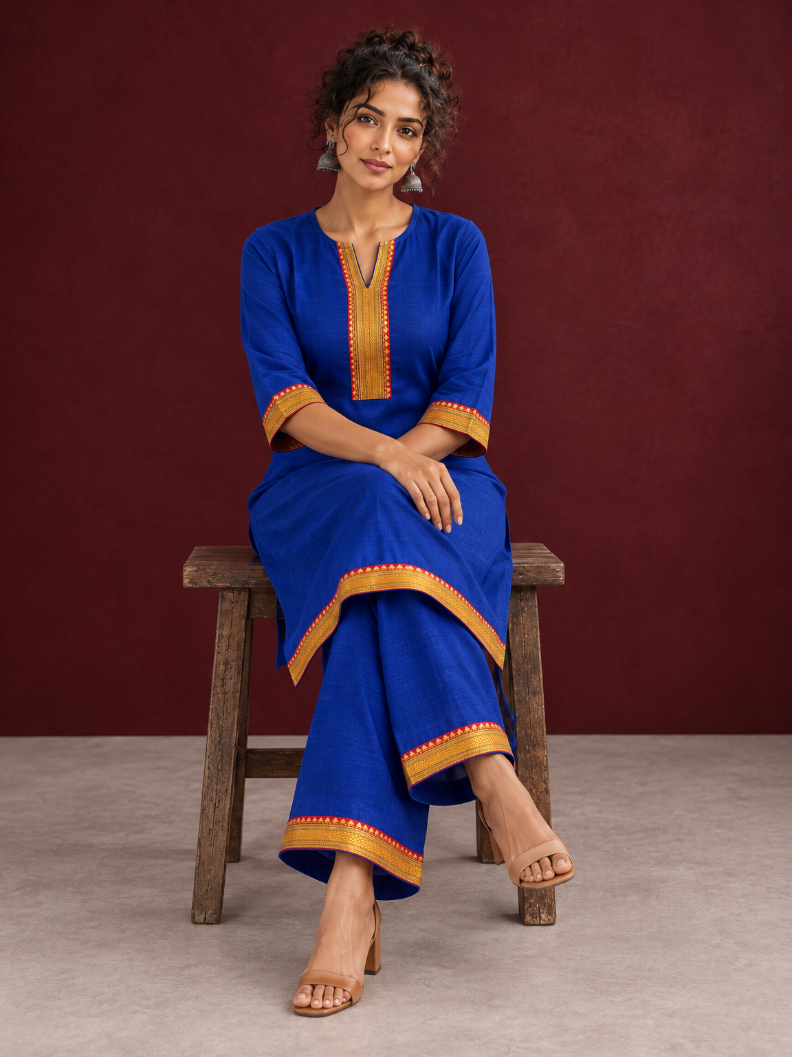 Elegant Royal Blue Cotton Silk Kurta with Contrast Mustard & Red Traditional Border On Neckline and Sleeve Cuffs — seated — view 7
