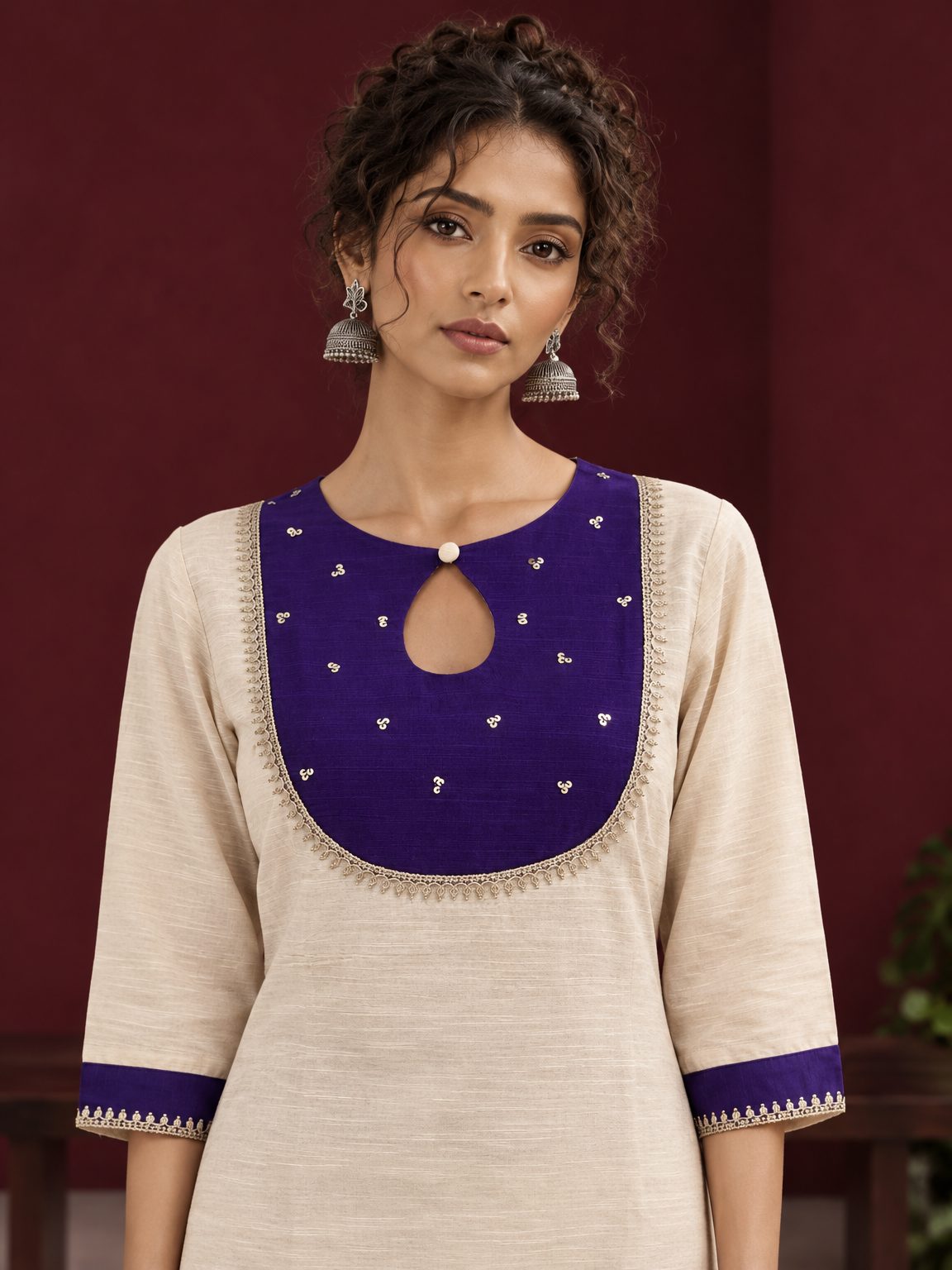 Elegant Off-White Silk Kurta with Contrast Purple Yoke Panel & Hand Embroidered Sequin Detailing — fabric detail — view 2