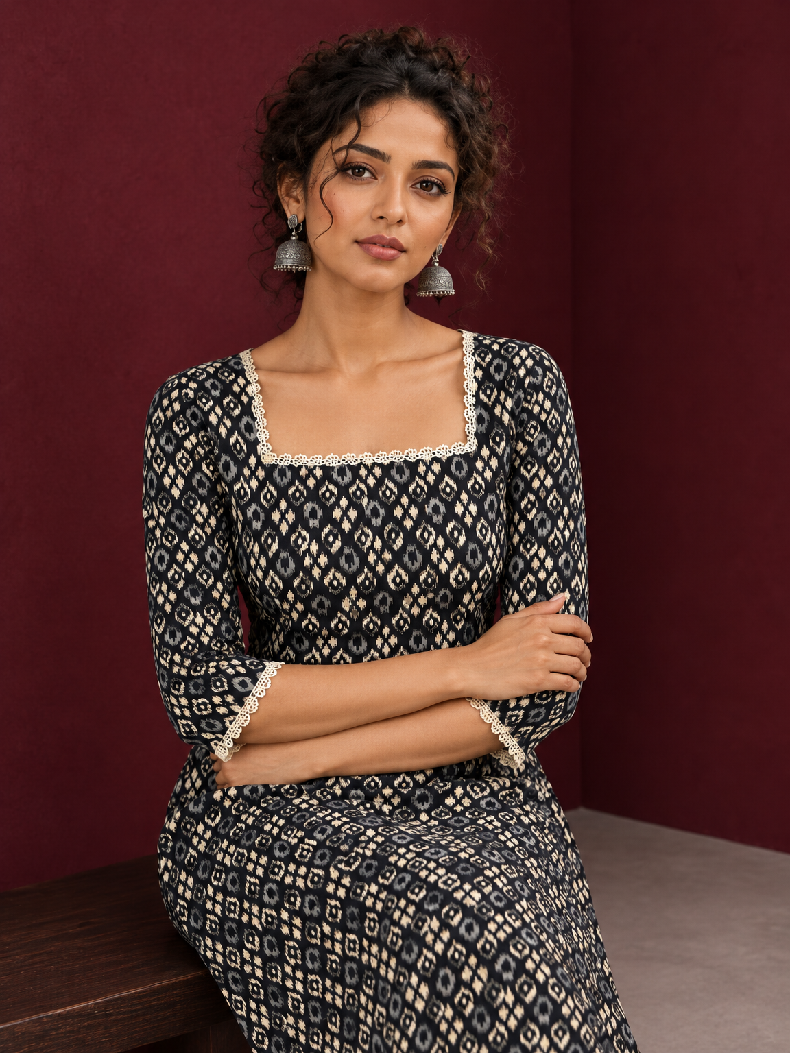 Elegant Black Printed Kurta with Beige Crochet Lace Square Neckline & Sleeves Trims — seated detail — view 4