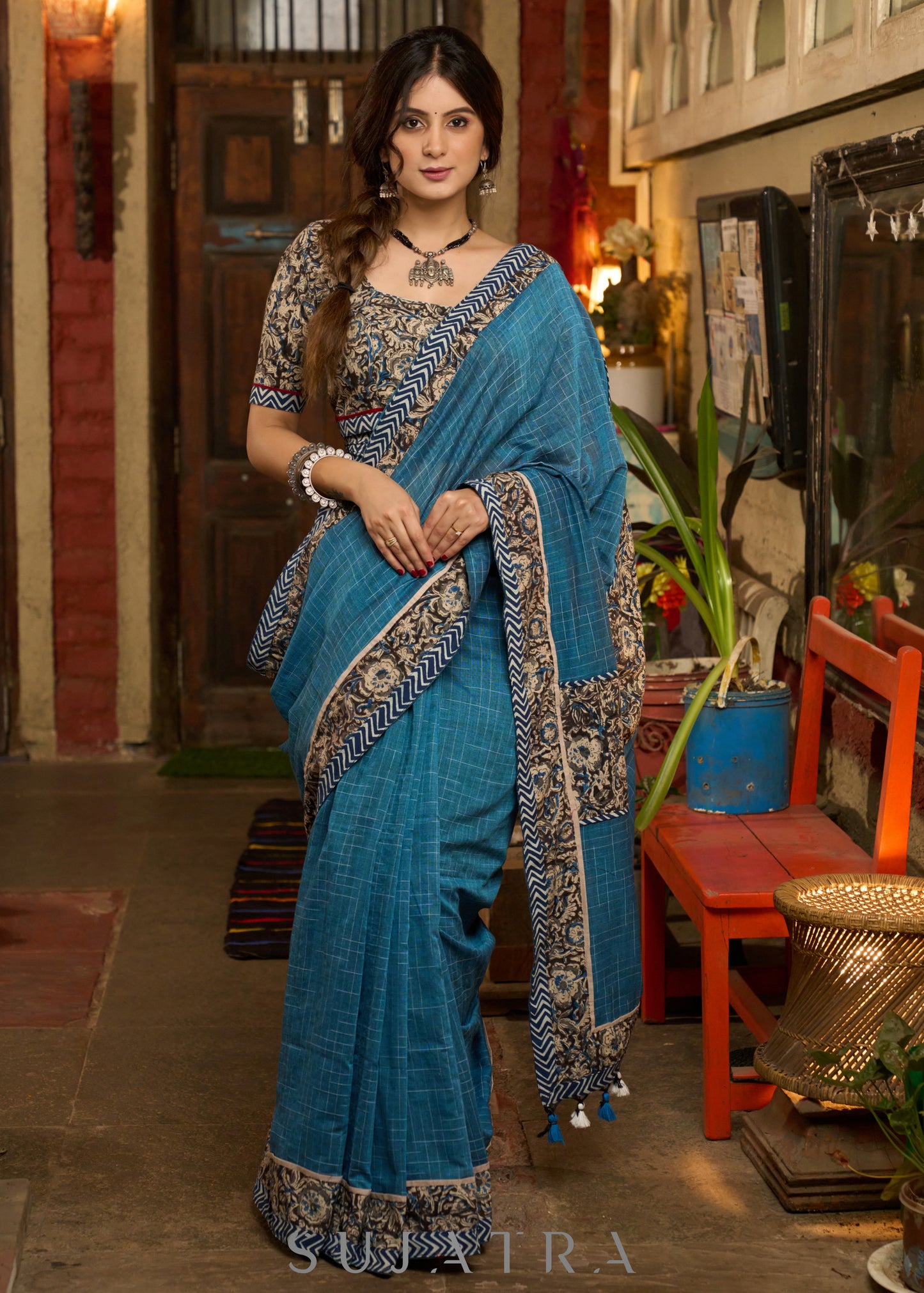 Exclusive Teal blue cotton saree highlighted with kalamkari and indigo borders