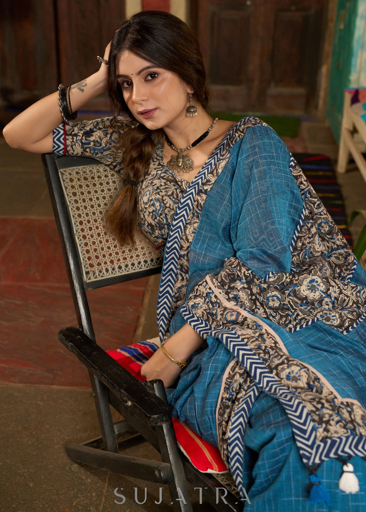 Exclusive Teal blue cotton saree highlighted with kalamkari and indigo borders