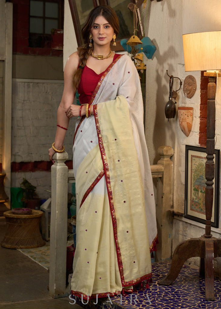 Elegant silver & golden linen half and half saree highlighted with contrast mirror work