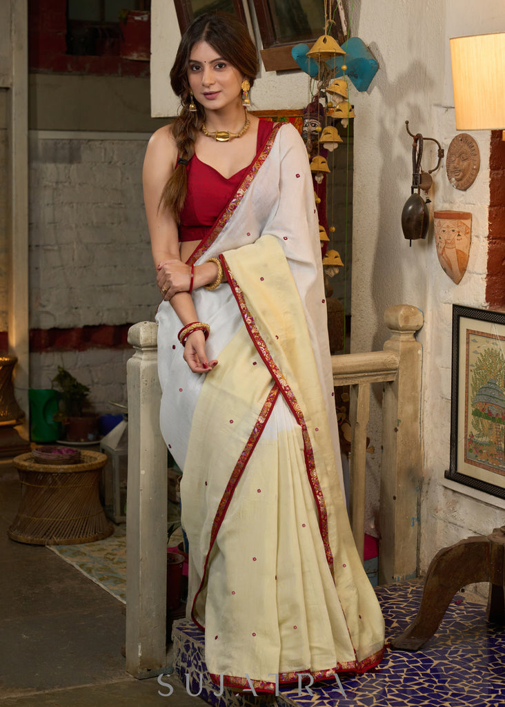 Graceful ivory cotton saree highlighted with beautiful overall intricate embroidery
