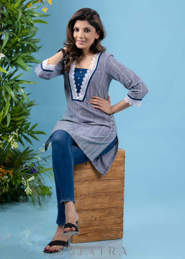 Stylish sky blue textured cotton tunic highlighted with beautiful lace