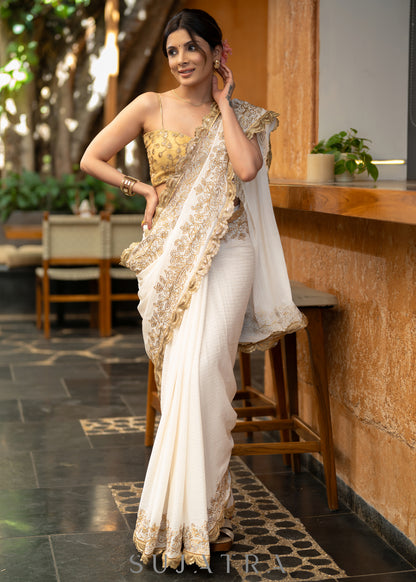Subtle White Georgette Saree With Beautiful Sequenced Crochet Highlighted With Intricate Floral Embroidery And Scalloped Lace