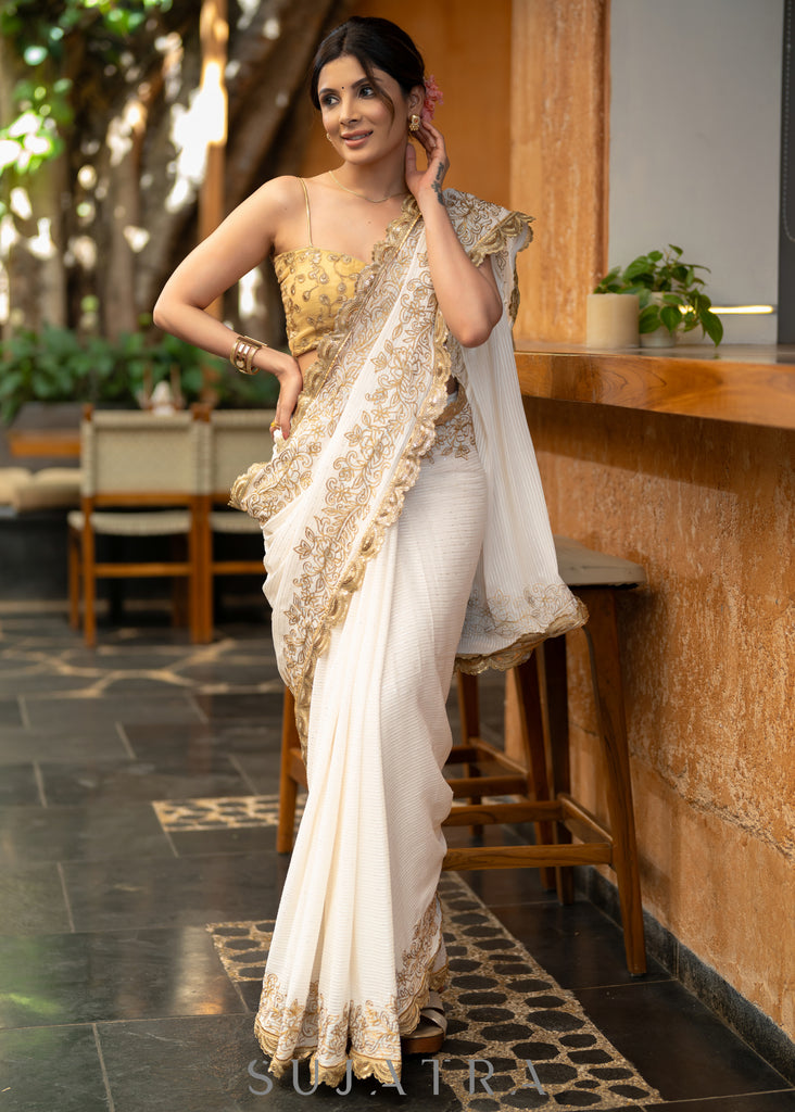 Subtle White Georgette Saree With Beautiful Sequenced Crochet Highlighted With Intricate Floral Embroidery And Scalloped Lace