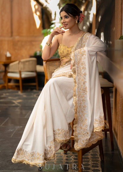 Subtle White Georgette Saree With Beautiful Sequenced Crochet Highlighted With Intricate Floral Embroidery And Scalloped Lace