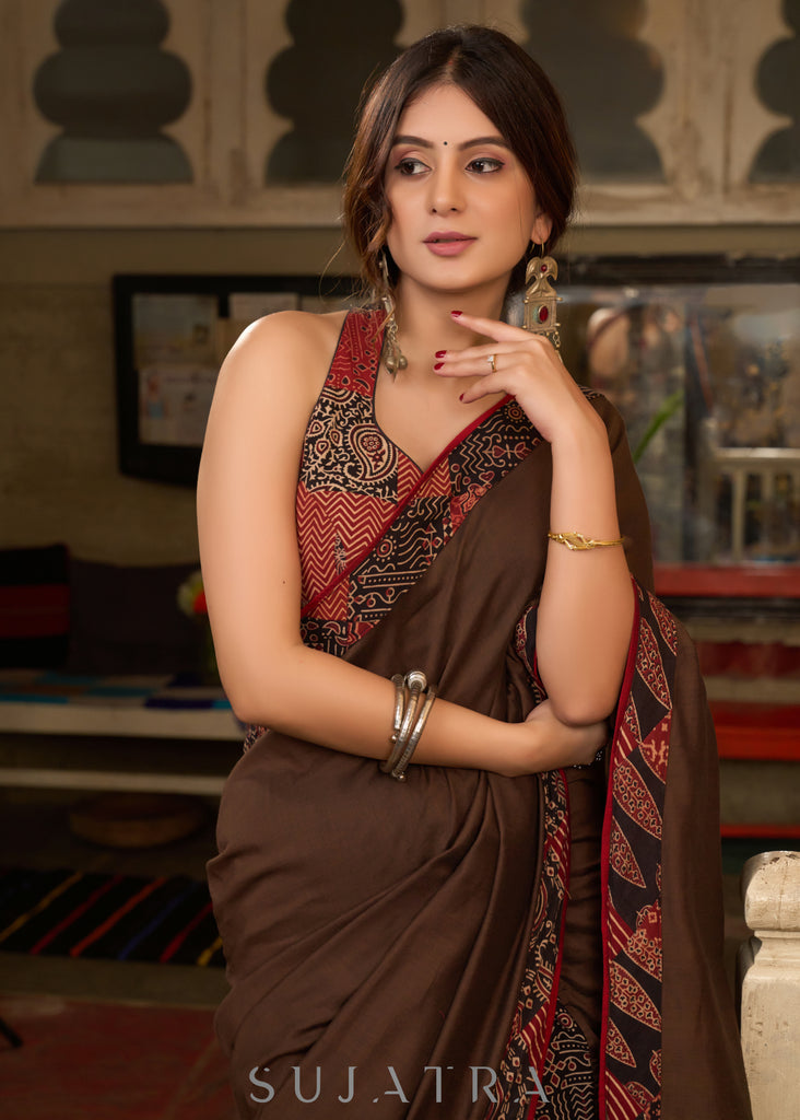 Exclusive brown cotton ajrakh combination saree highlighted with ajrakh patchwork