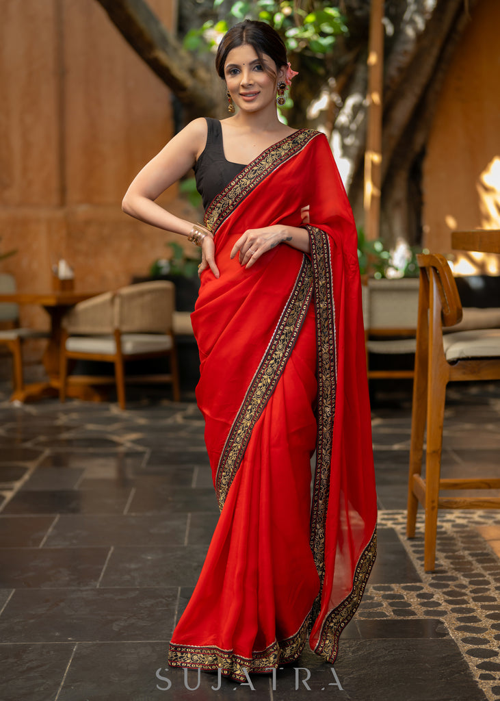 Classy Red Organza Saree Highlighted with Beautiful Embroidered Border.