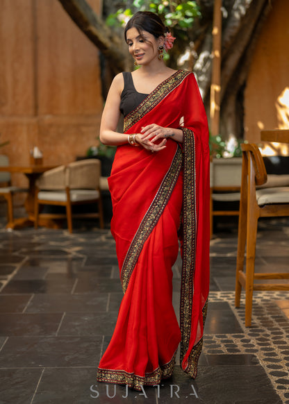 Classy Red Organza Saree Highlighted with Beautiful Embroidered Border.