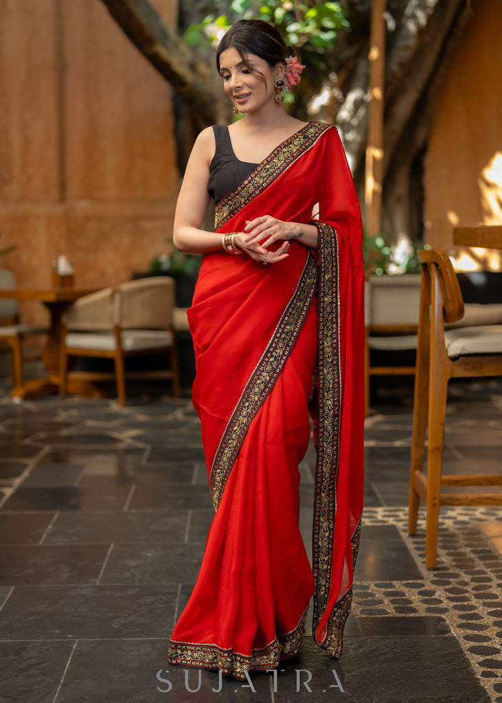 Classy Red Organza Saree Highlighted with Beautiful Embroidered Border.