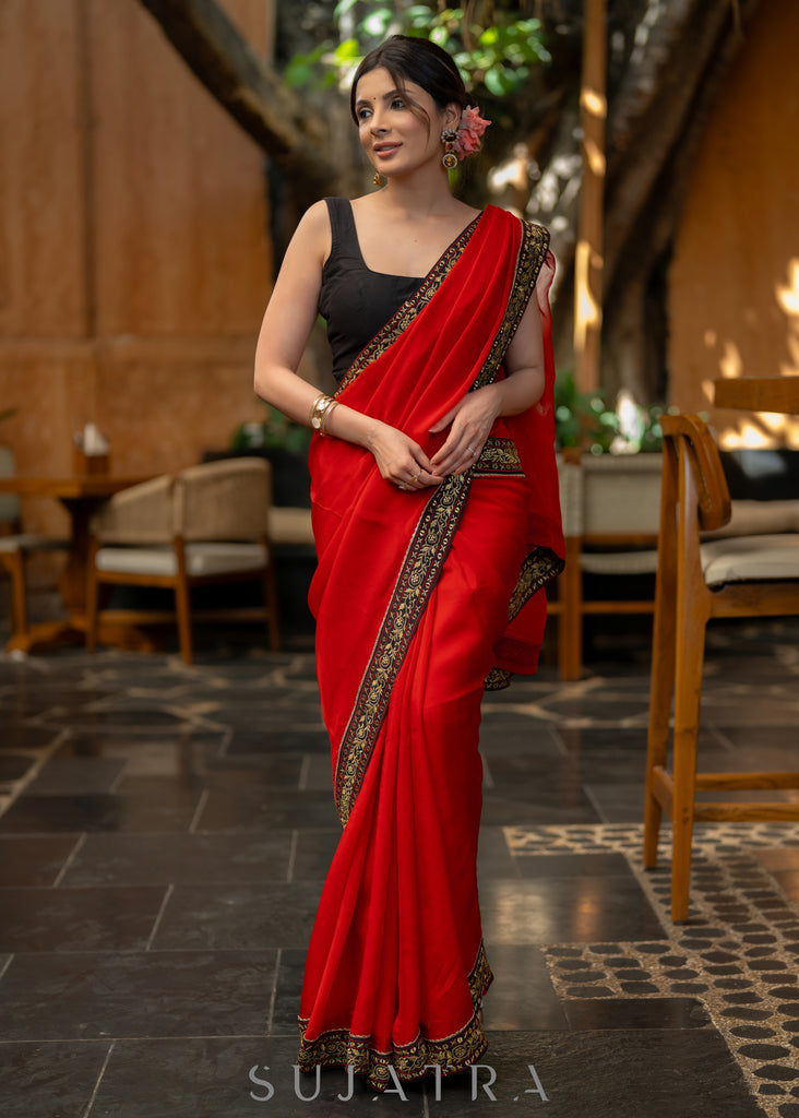 Classy Red Organza Saree Highlighted with Beautiful Embroidered Border.