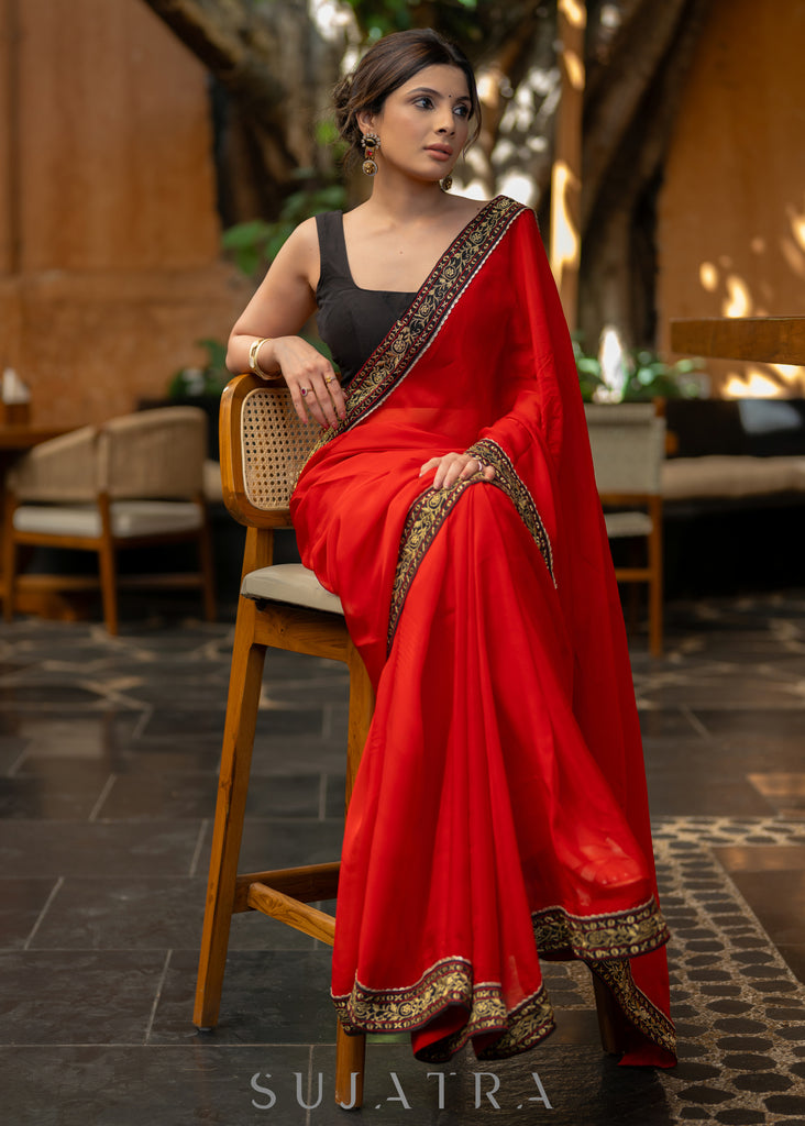 Classy Red Organza Saree Highlighted with Beautiful Embroidered Border.