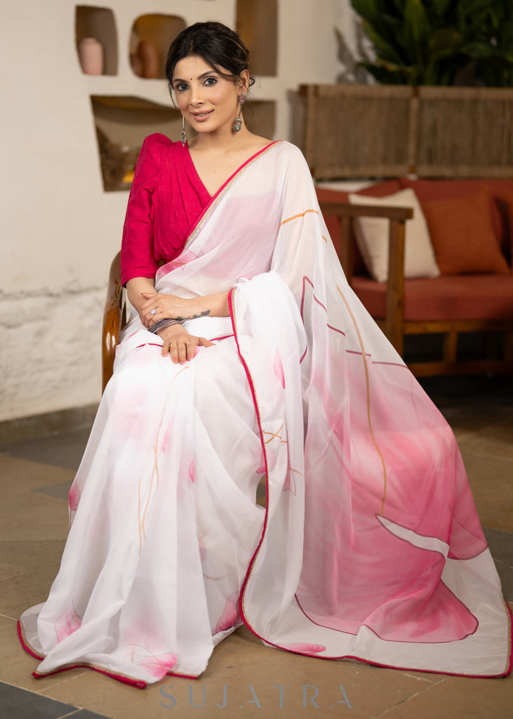 Stylish White Organza Saree With Overall Floral Brush Painting Highlighted With Minimal Lace