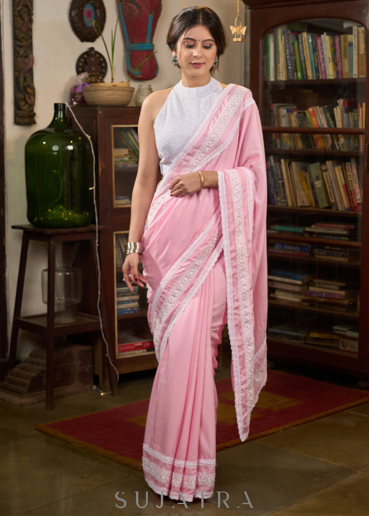Beautiful powder pink modal cotton saree highlighted with beautiful laces
