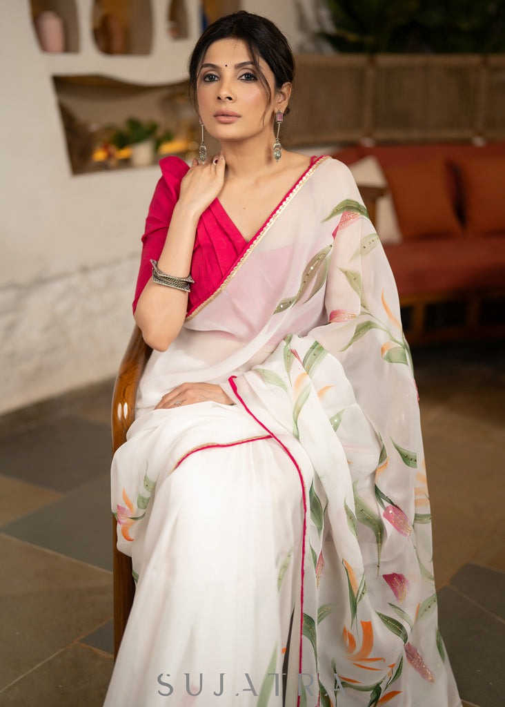 Trendy White Organza Saree With Overall floral Brush Painting Highlighted With Minimal Hand Embroidery