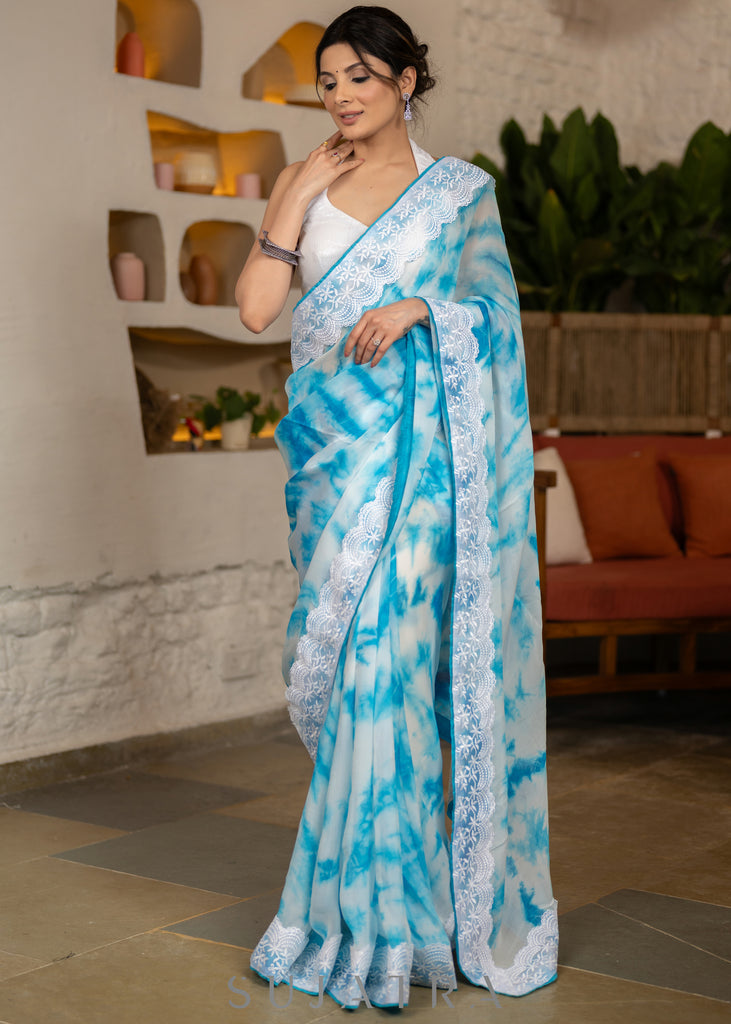 Beautiful Sky Blue Tie & Dye Organza Saree Highlighted With Matching Crochet Lace