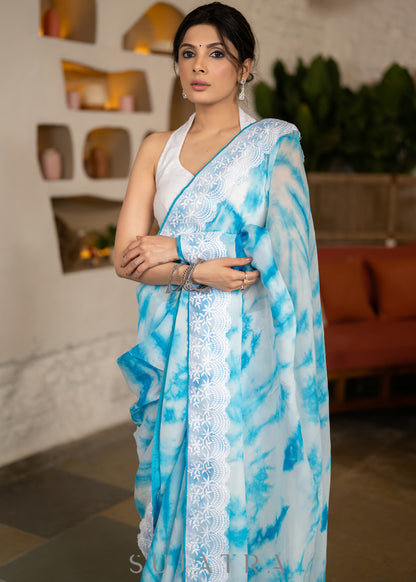 Beautiful Sky Blue Tie & Dye Organza Saree Highlighted With Matching Crochet Lace