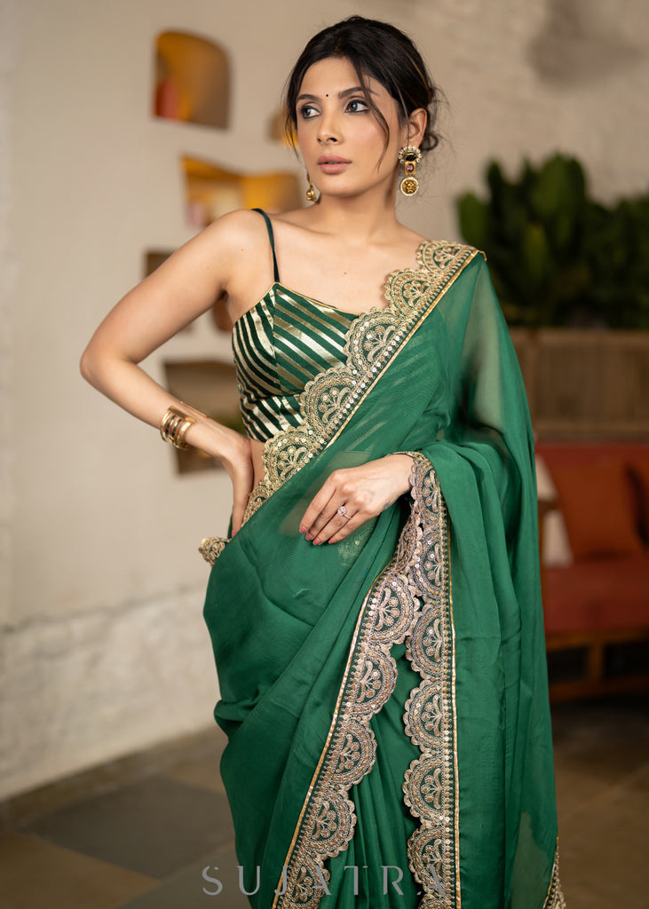 Graceful Bottle Green Organza Saree Highlighted With Matching Scalloped Lace