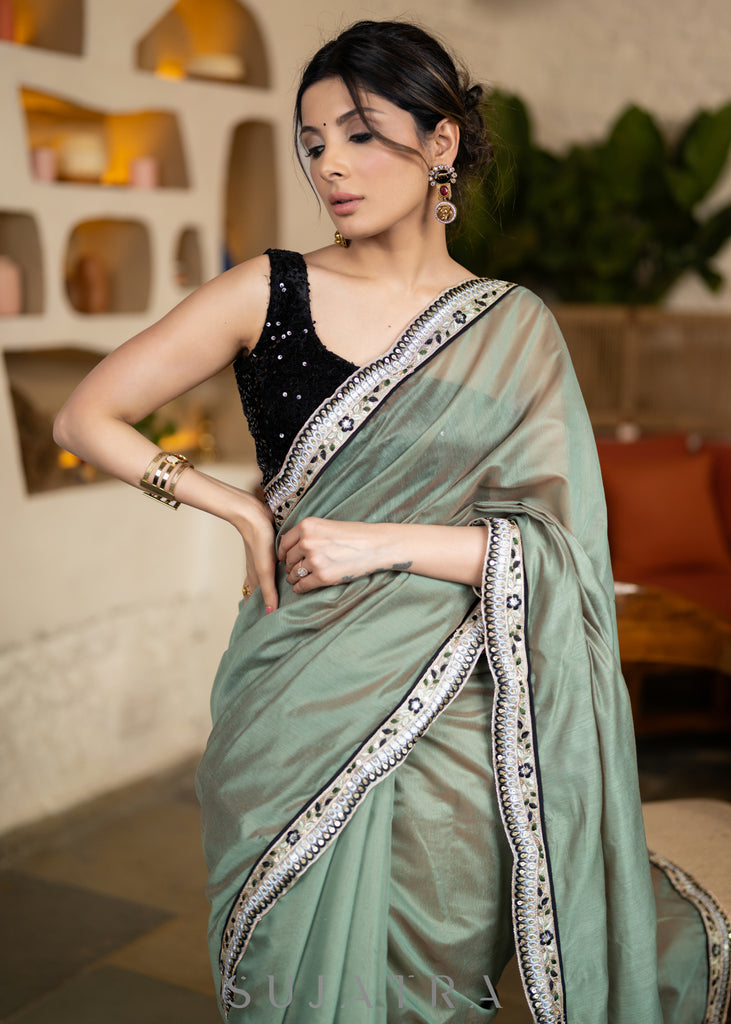 Elegant Sage Green Chanderi Saree Highlighted With Contrast Floral Lace