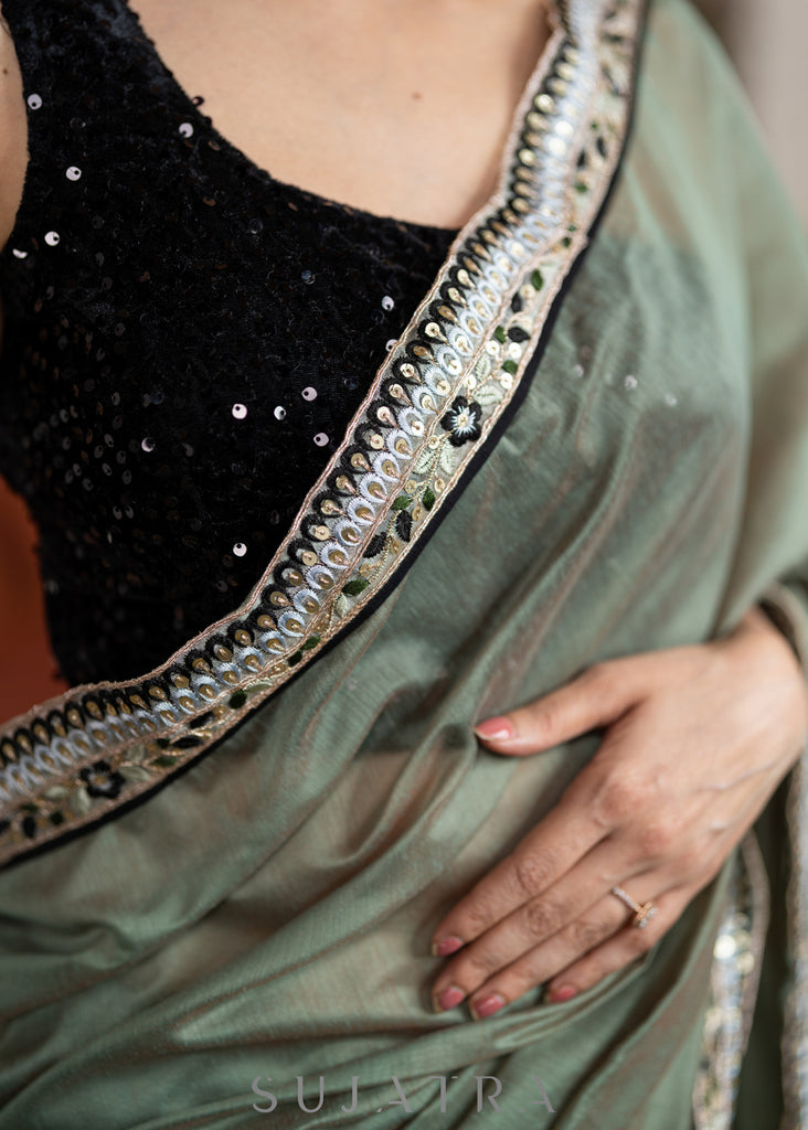Elegant Sage Green Chanderi Saree Highlighted With Contrast Floral Lace