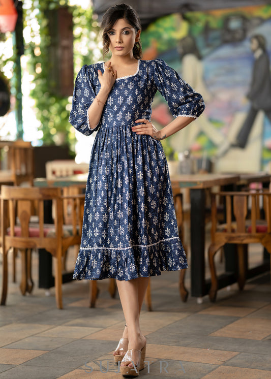 Trendy navy blue floral printed rayon gathered dress highlighted with beautiful lace