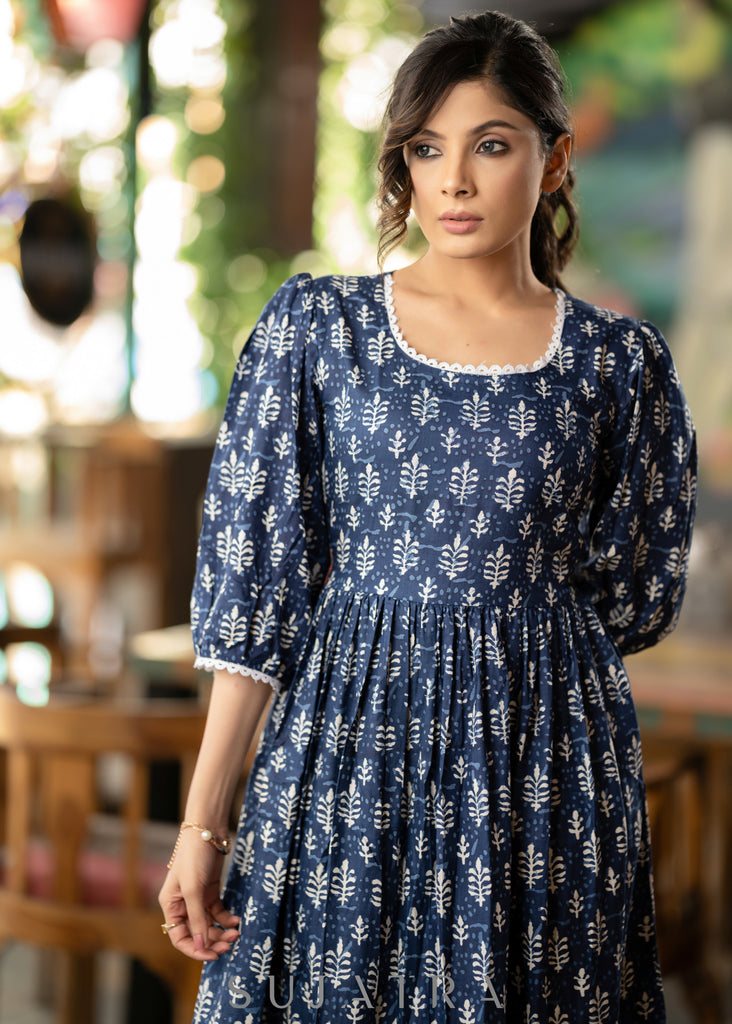 Trendy navy blue floral printed rayon gathered dress highlighted with beautiful lace