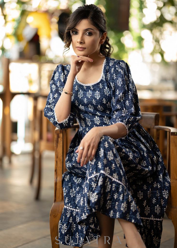 Trendy navy blue floral printed rayon gathered dress highlighted with beautiful lace