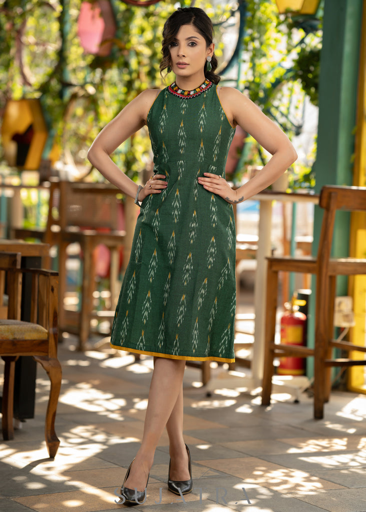Smart green cotton ikat halter neck dress with beautiful kutch lace on the neckline