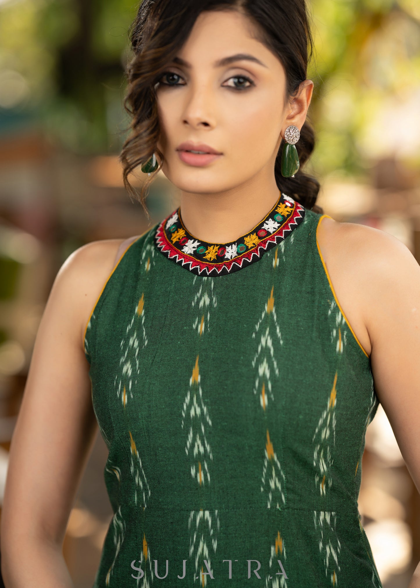 Smart green cotton ikat halter neck dress with beautiful kutch lace on the neckline