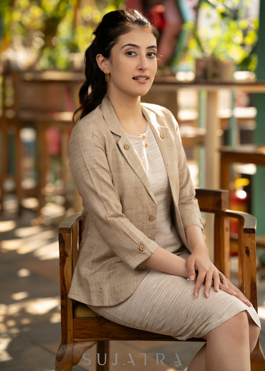 Beige blazer with striped dress