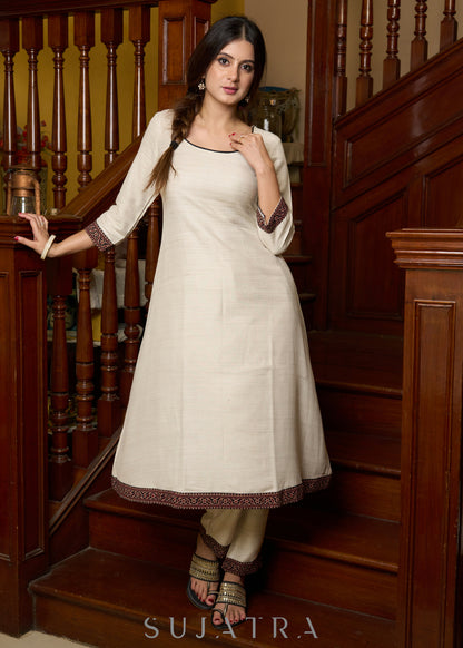 Off-white handloom kurta with contrast ajrakh highlights, paired with complementing pants - Patch work stole Optional