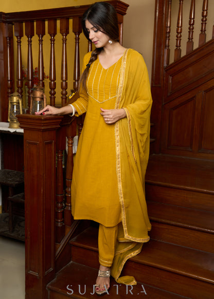 Graceful delicate mustard cotton kurta with a lace yoke and matching pants - Dupatta Optional