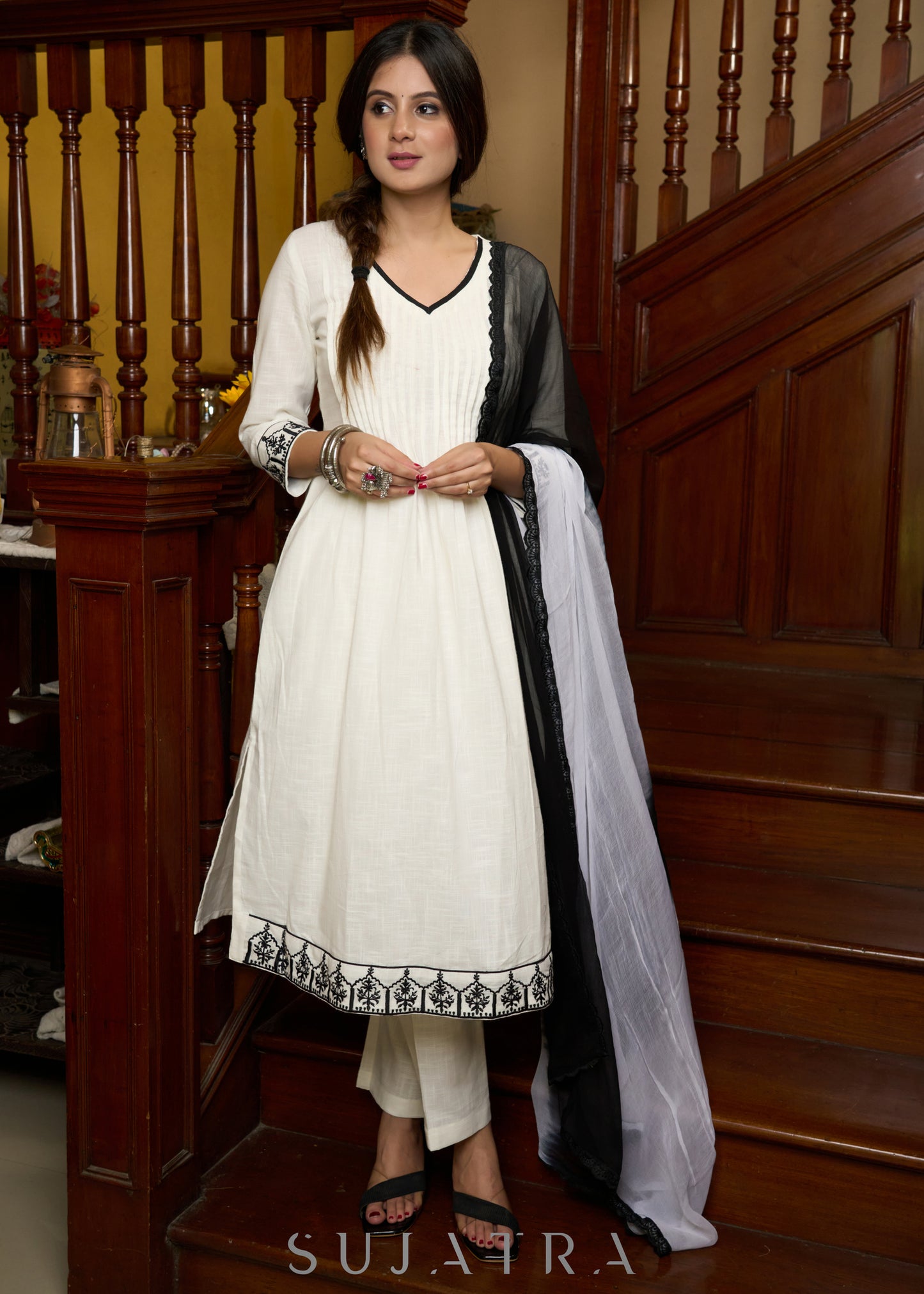Elegant off-white cotton kurta adorned with intricate embroidery