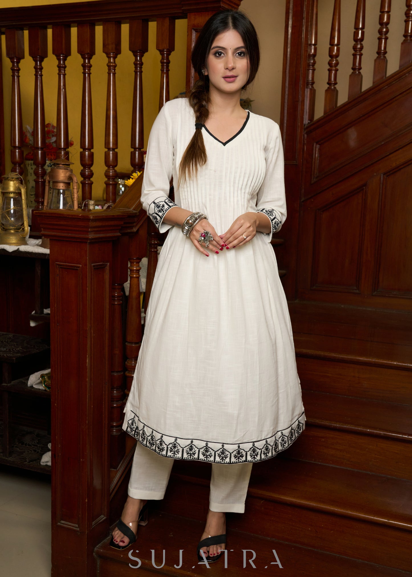 Elegant off-white cotton kurta adorned with intricate embroidery