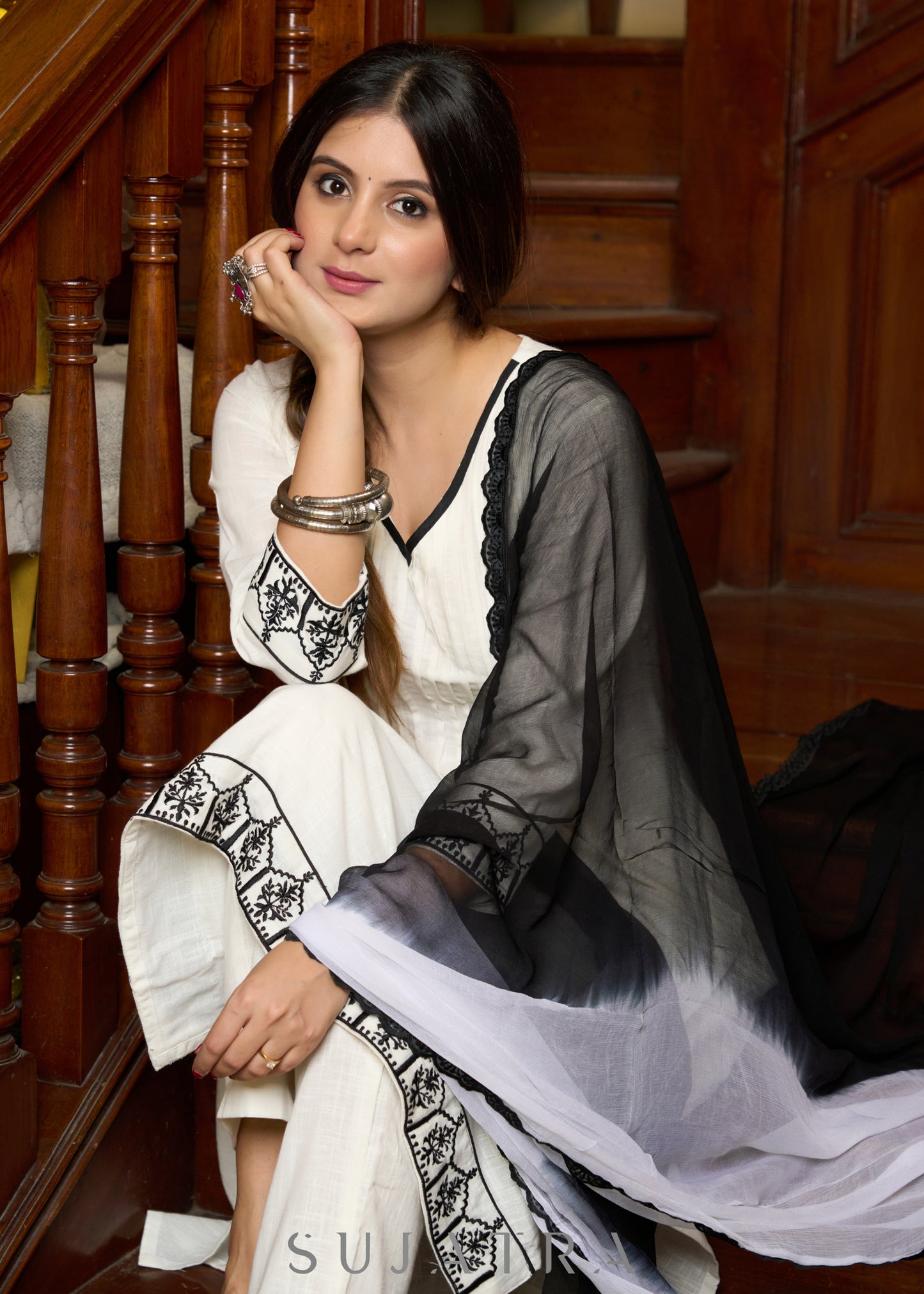 Elegant off-white cotton kurta adorned with intricate embroidery