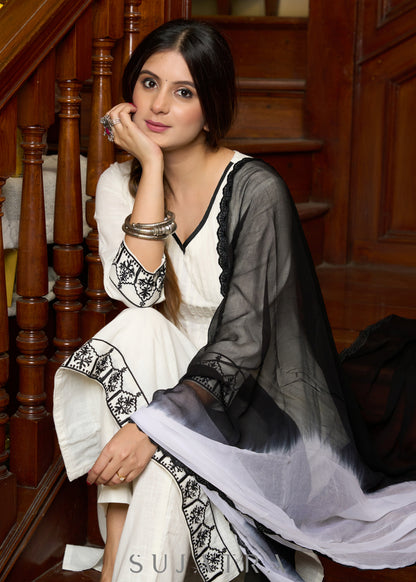 Elegant off-white cotton kurta adorned with intricate embroidery