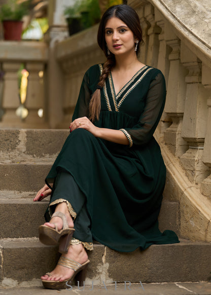 Elegance redefined in this captivating green georgette lace kurta -  Pant additional